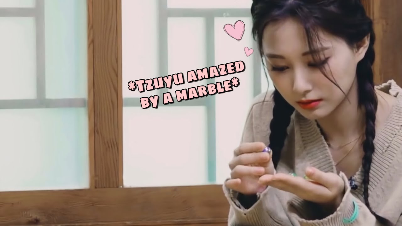 Tzuyu being amazed by a marble is so cute